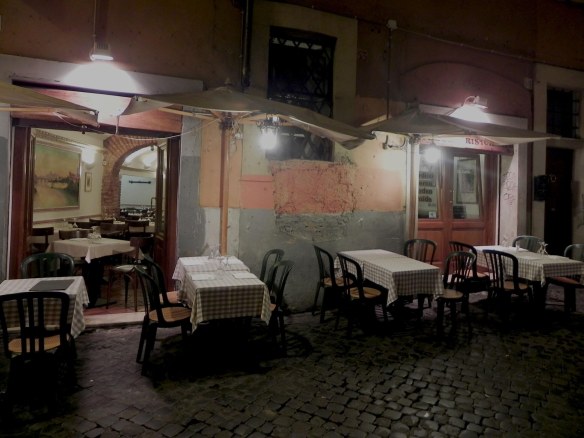 a sequence of outdoor seating table picture of a restaurant in trastevre 