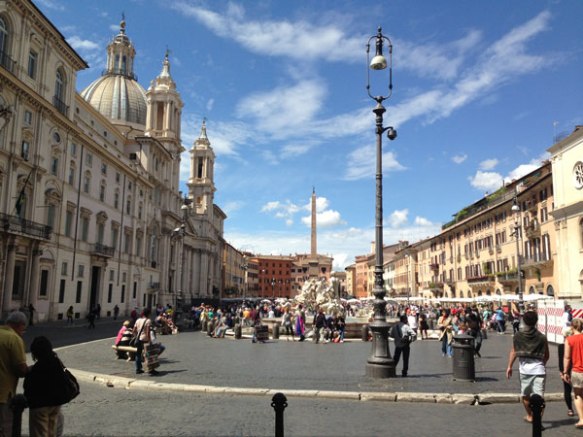 This is a photo of Piazza Novona, blue skies beautiful architecture in rome italy 