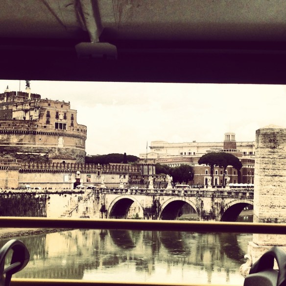 an iphone photo of st angelo in rome with the colors of brown and green eartthy and natural