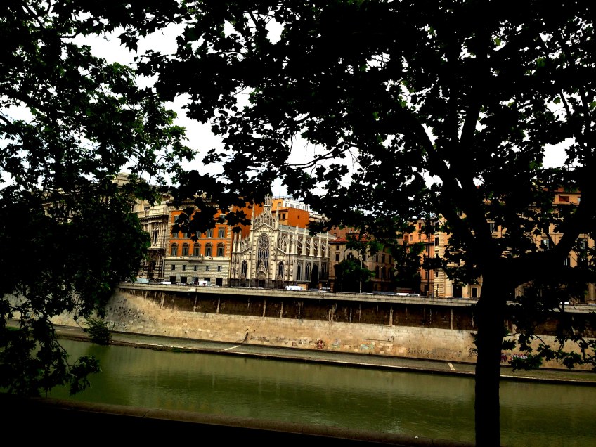 photo of trees river and architecture the beauty of rome italy travel
