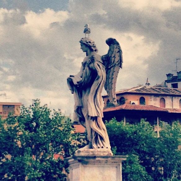 a far view of the bird on top of the saint angelo statue 