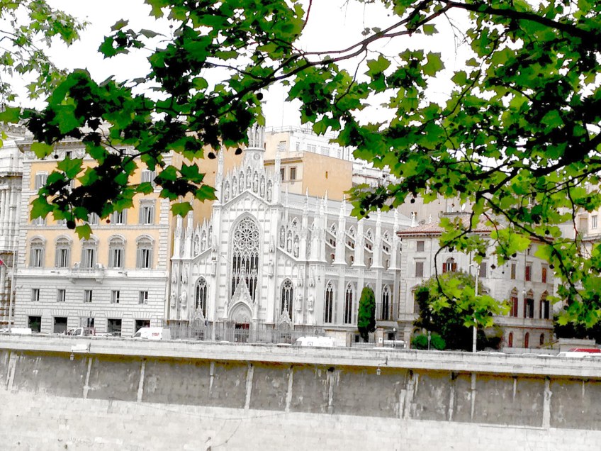 this photo reminds me of barcelona from the architecture of the church white between vintage buildings in roma