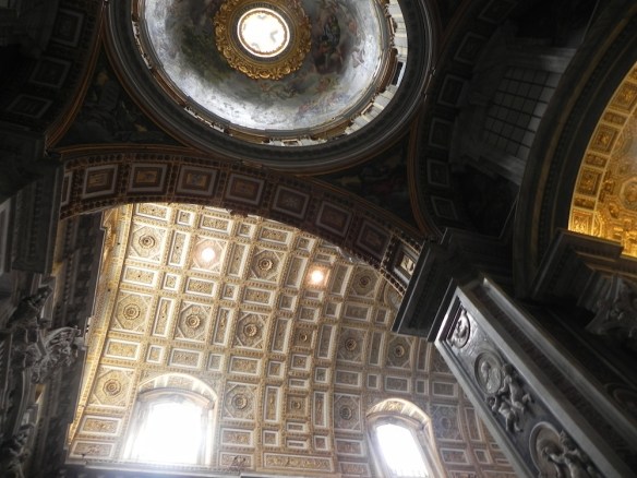 a stunning photo of the gold plates and architecture located inside the vatican 