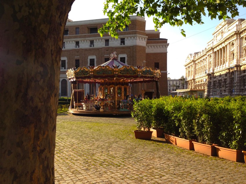 it is time for marry go round by the river tevere in rome on a stunning sunny day