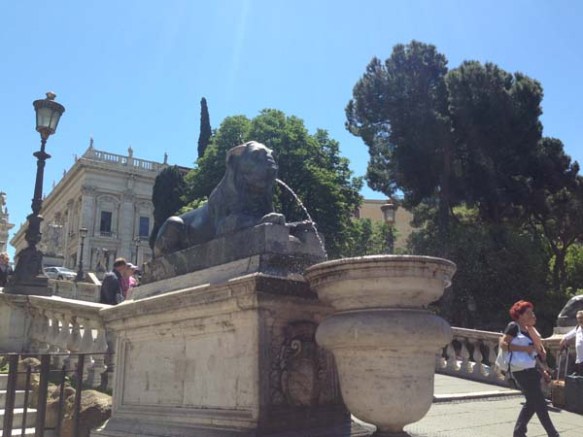 Lion statue water fountain at piazza venezia 