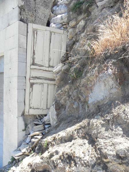 White small door in the middle of a hill in downtown al balad Amman