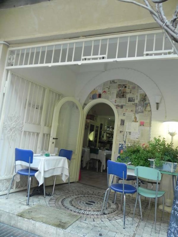 A picture of a restaurant with tables and chairs at rome  