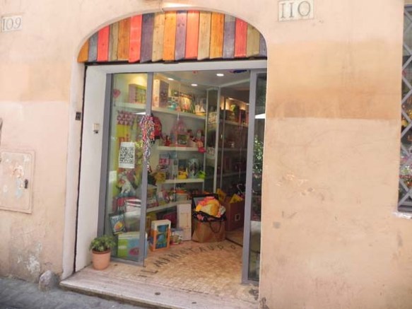 an entrance of a very unique boutique with colored stripes