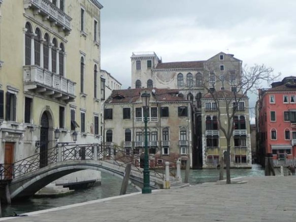 A photo of architecture in venice that looks like a painting with a very cold feeling of winter and sharp features 