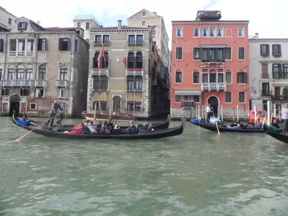 A gondola and a gondolier at the Grand Canal venice