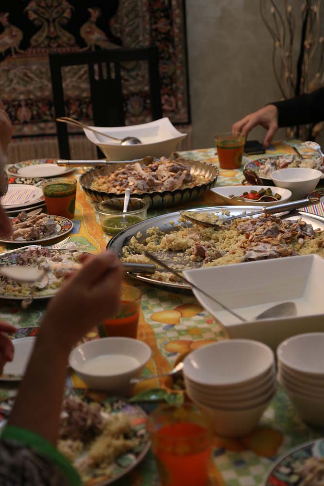 Jordanian Palestinian family having mansaf for dinner