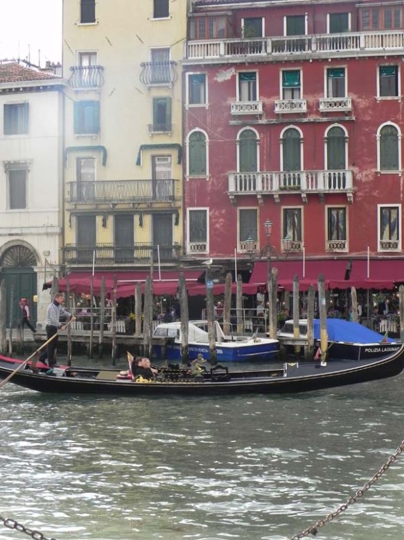 A gondola and a gondolier at the Grand Canal architecture of venice 