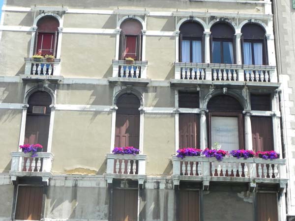 Architecture in venice is breathtaking specially with the beautiful cute little windows and decorations art is in everything purple fuscia flowers