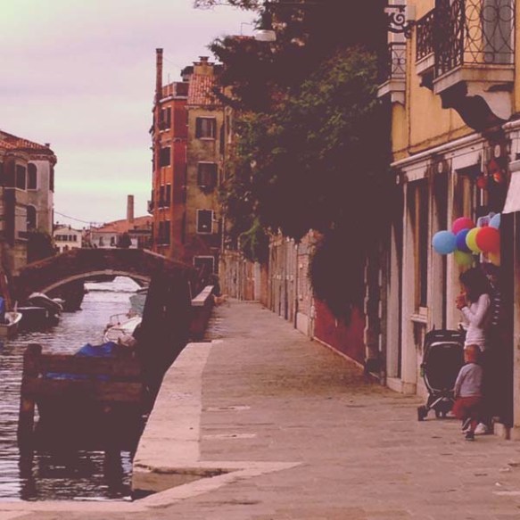Mother child balloons infront of a shop in venice venezia grand canal love