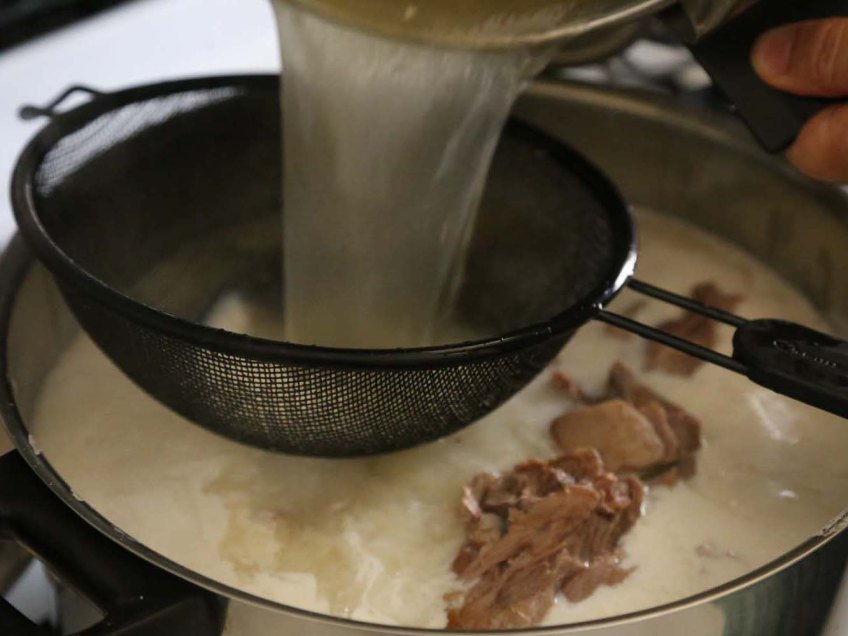 Making Mansaf Recipe cooked lamb broth