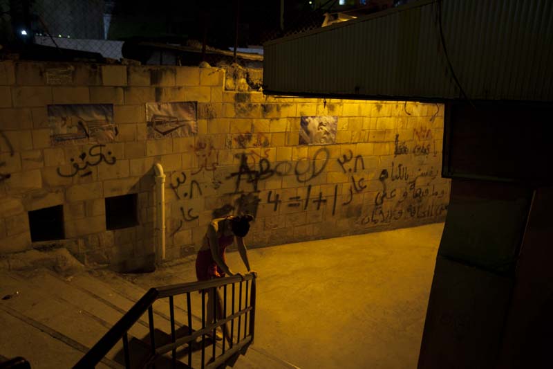 Ballet dancer during our photography project at this ghetto area in amman webdeh jordan jadal culture with dimmed street light