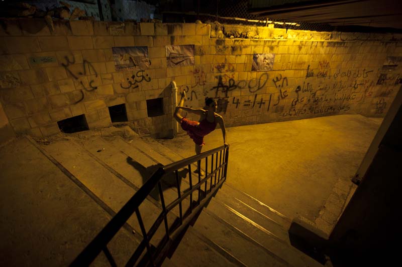 Ballet dancer during our photography project at this ghetto area in amman webdeh jordan jadal culture with dimmed street light
