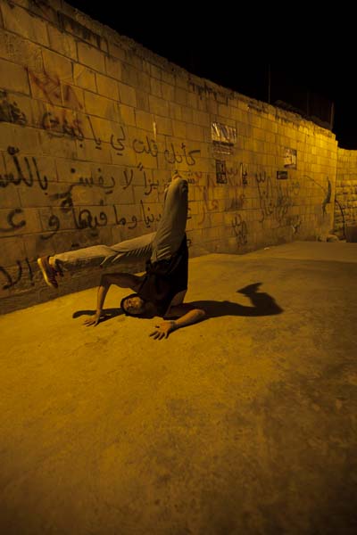 dancer during our photography project at this ghetto area in amman webdeh jordan jadal culture with dimmed street light