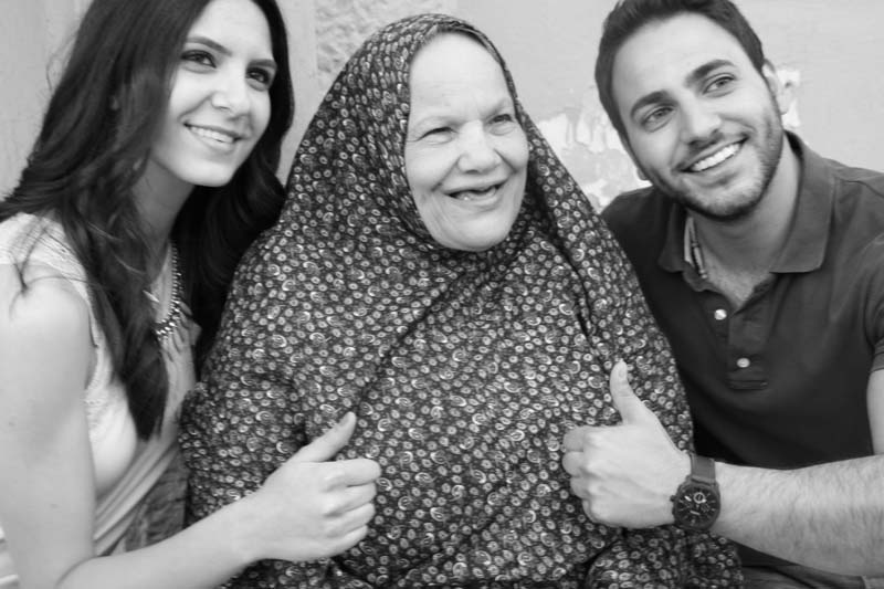 Black and white hijabi woman with 2 models thumbs up photograph