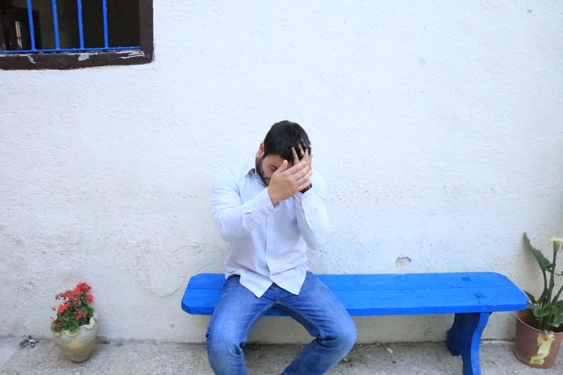 Blue bench with model sitting at Jadal culture