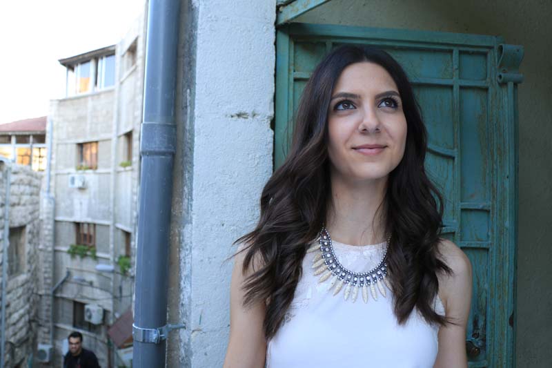 Model leen from modelicious posing with green door as background