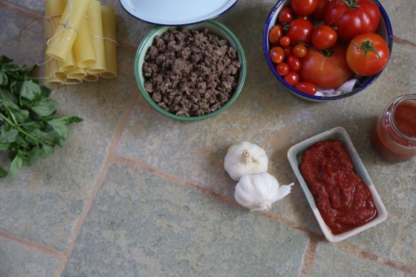 A photograph of Cannelloni pasta fresh tomato's garlic tomato paste and minced meat