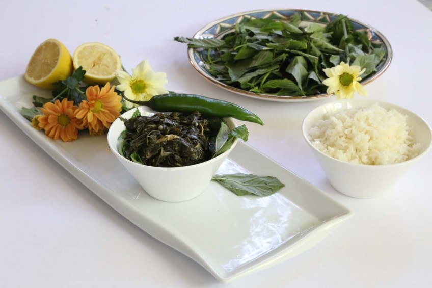 A Middle-Eastern Aranian dish Mulukhiah Mloukhieh green leaves vegetables with rice