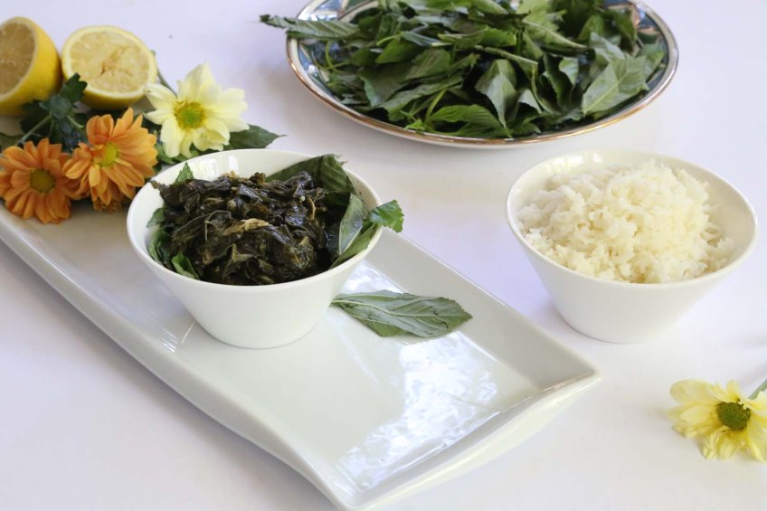 A Middle-Eastern Aranian dish Mulukhiah Mloukhieh green leaves vegetables with rice food art culinary styling