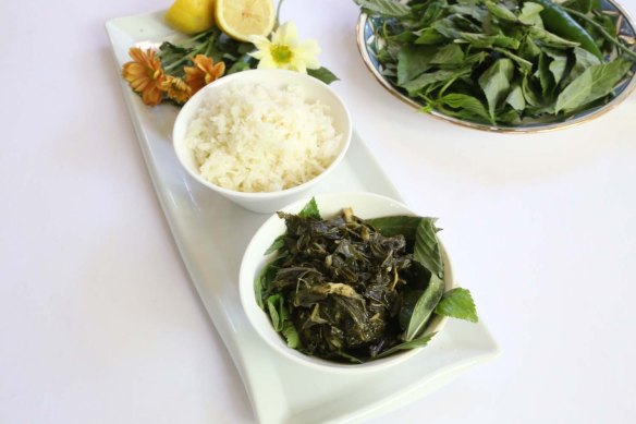 A Middle-Eastern Aranian dish Mulukhiah Mloukhieh green leaves vegetables with rice