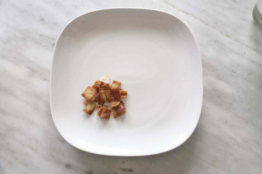 Middle-Eastern Eggplant Casseroles also known as Fatet Batinjan فتت بيتنجان or Fatet Makdous فتيت مكدوس empty white plate add fried bread