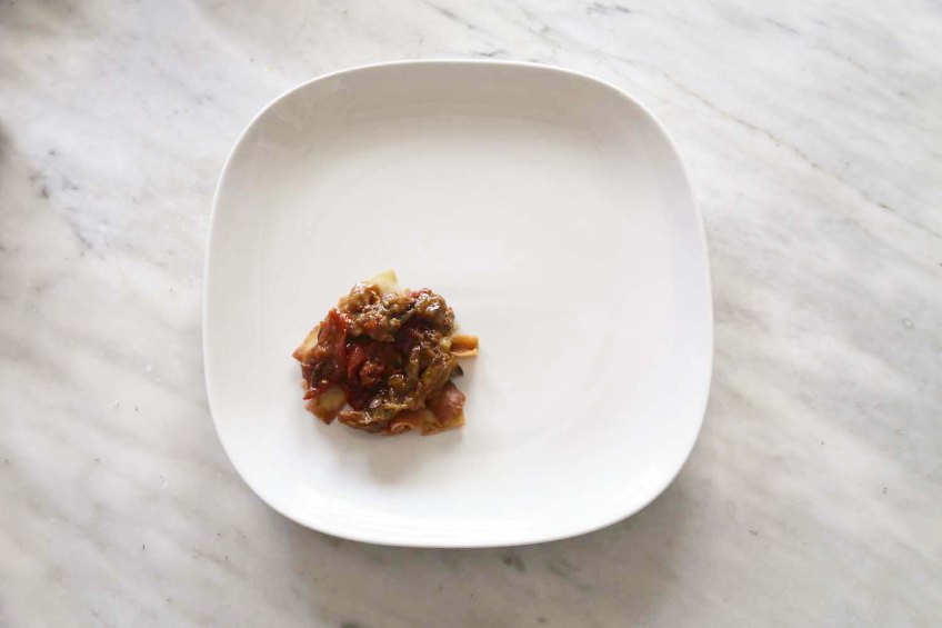 Middle-Eastern Eggplant Casseroles also known as Fatet Batinjan فتت بيتنجان or Fatet Makdous فتيت مكدوس empty white plate add fried bread