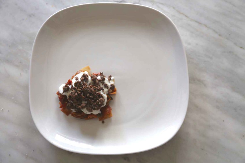 Middle-Eastern Eggplant Casseroles also known as Fatet Batinjan فتت بيتنجان or Fatet Makdous فتيت مكدوس empty white plate add fried bread