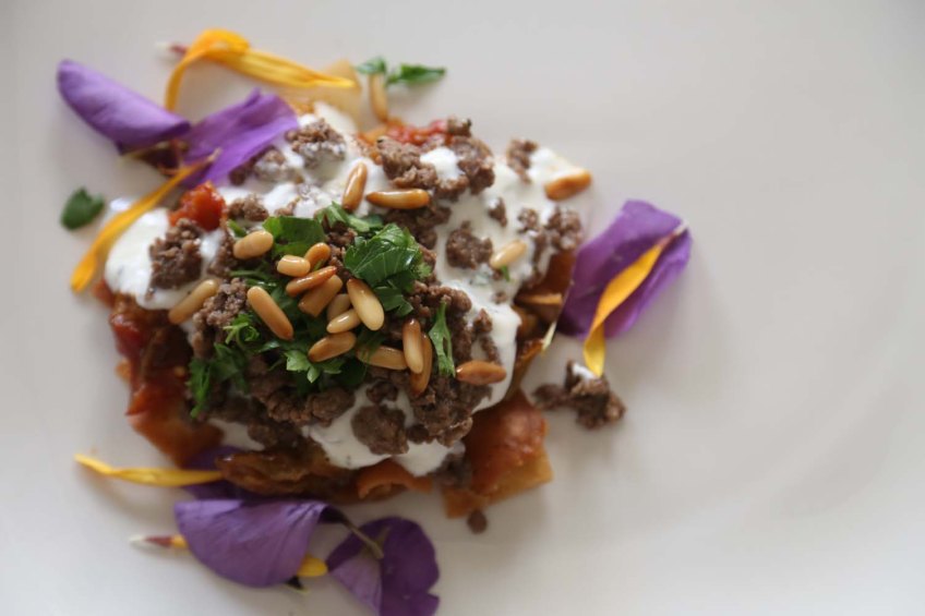 Middle-Eastern Eggplant Casseroles also known as Fatet Batinjan فتت بيتنجان or Fatet Makdous فتيت مكدوس empty white plate add fried bread