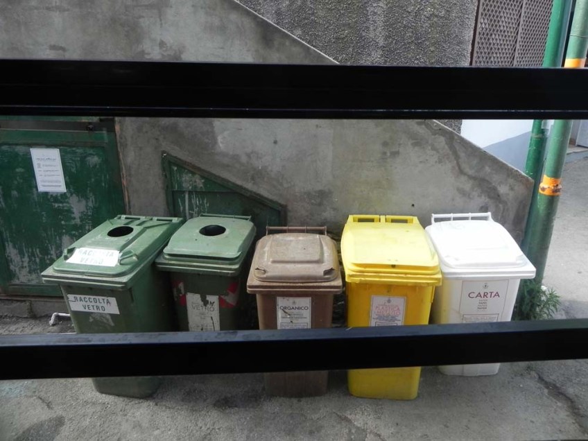 Capri Italy sequence of colored garbage bins