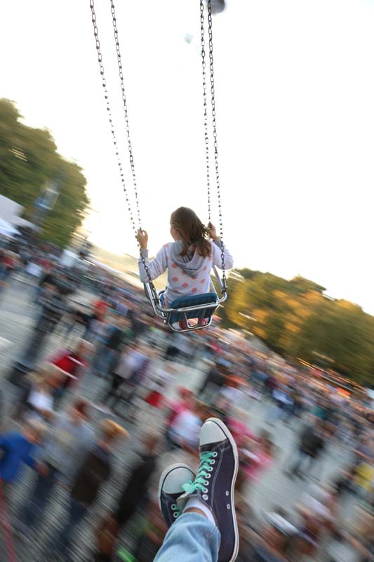 Swinging flying above people