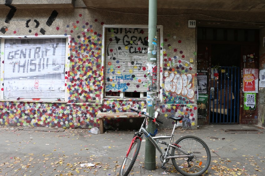 Polka dots wall with bicycle hanging there