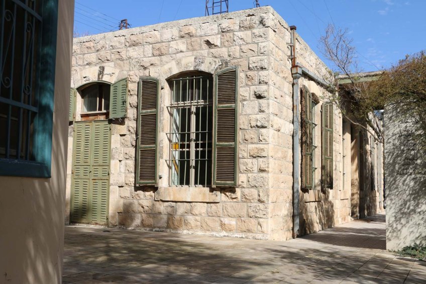 Old house with green doors and windows