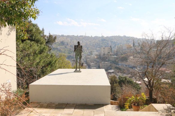 A statue of a man overlooking Amman Jordan 