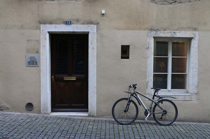 Bike parked at a beige wall building in solothurn