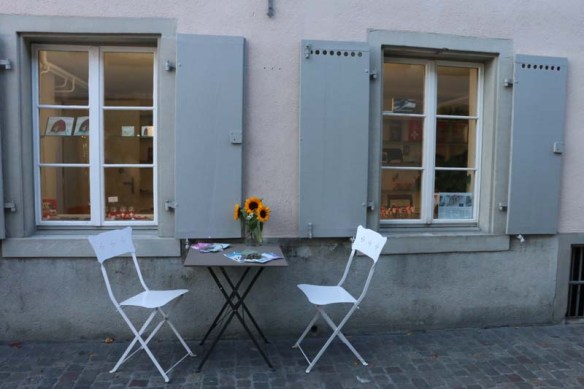 2 Seaters white chairs sunflower and a romantic date in the streets of Zurich 