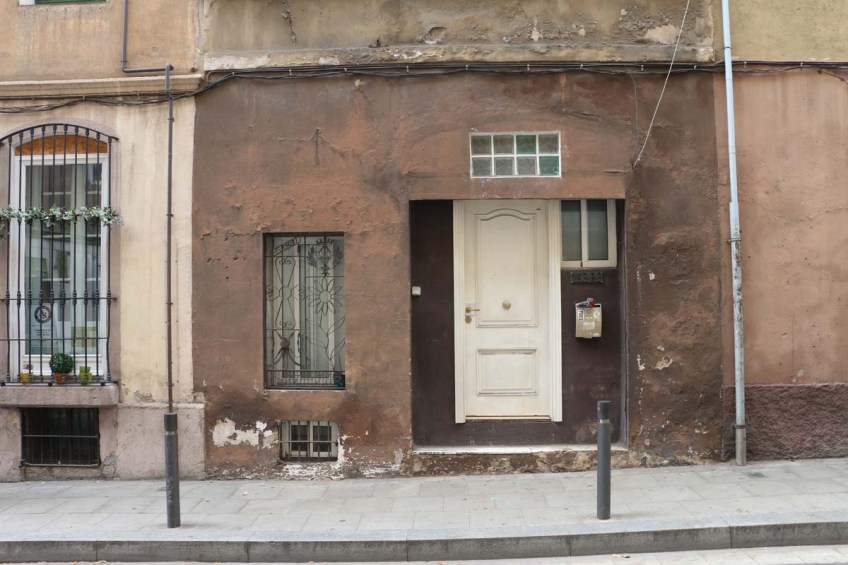 Brown old door and house in Barcelona
